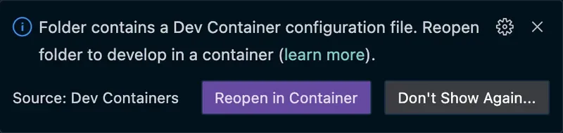 Visual Studio Code dialog showing option to reopen in container