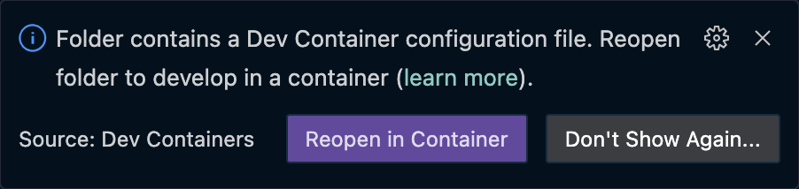 Visual Studio Code dialog showing option to reopen in container